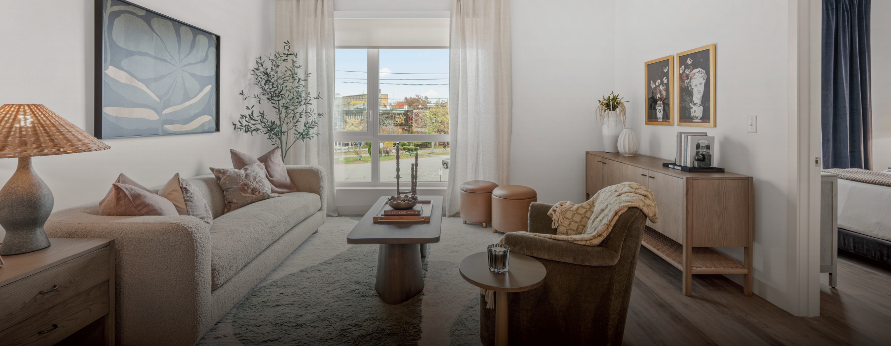 A living room with a couch, coffee table, and additional seating