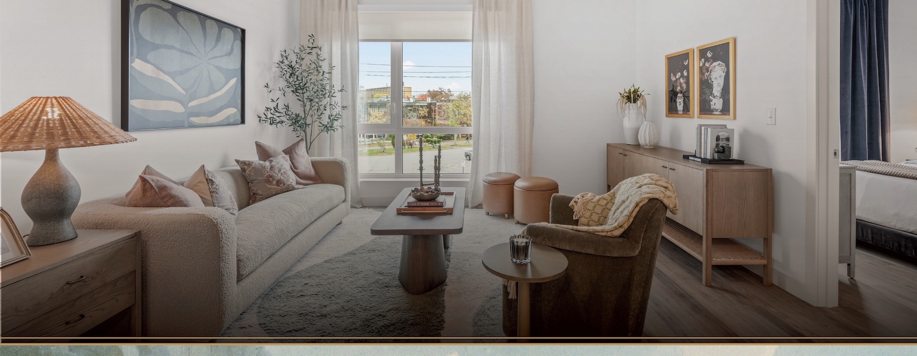 A living room with a couch, coffee table, and additional seating