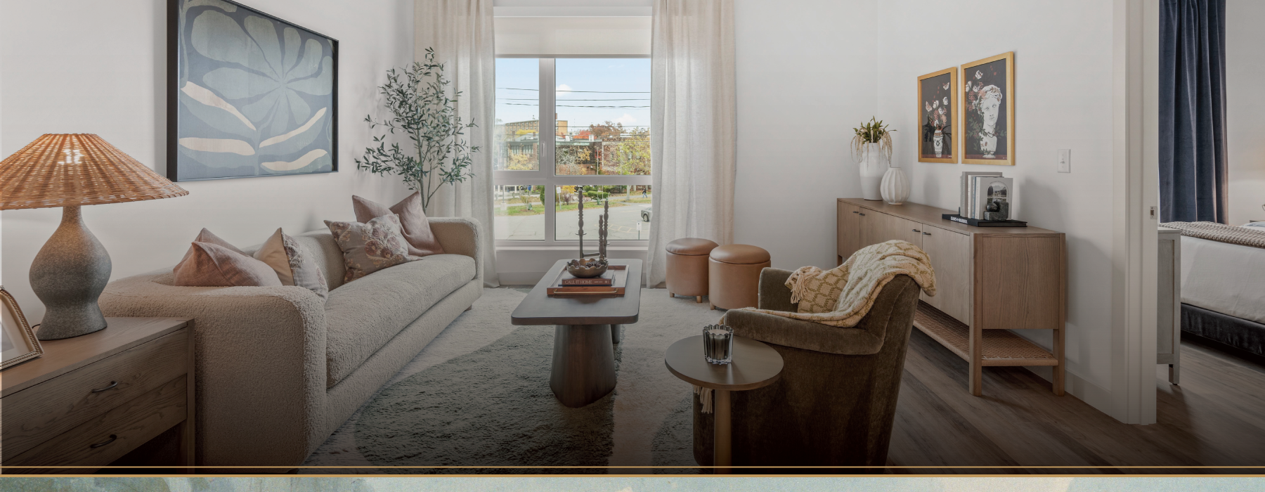 A living room with a couch, coffee table, and additional seating