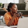 a woman drinking a cup of coffee