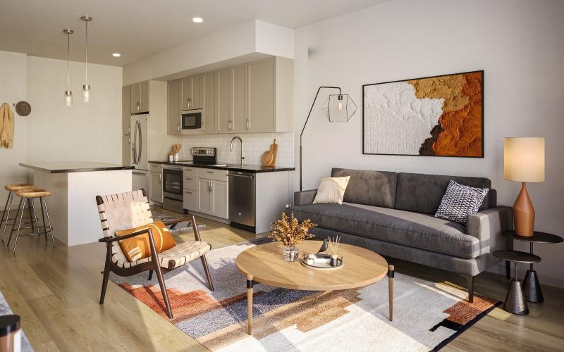 a living room with a couch and a table