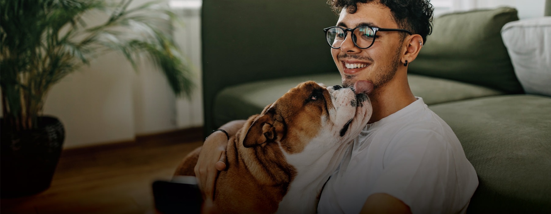 a man holding a dog
